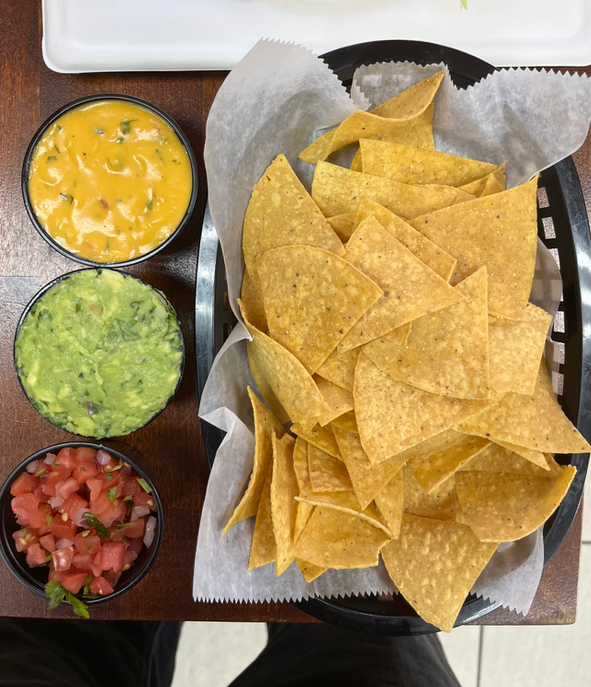 Chips with queso, guacamole and pico
